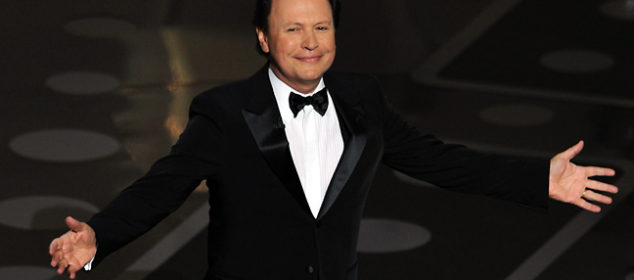 Comedian Billy Crystal arrives on stage at Oscars