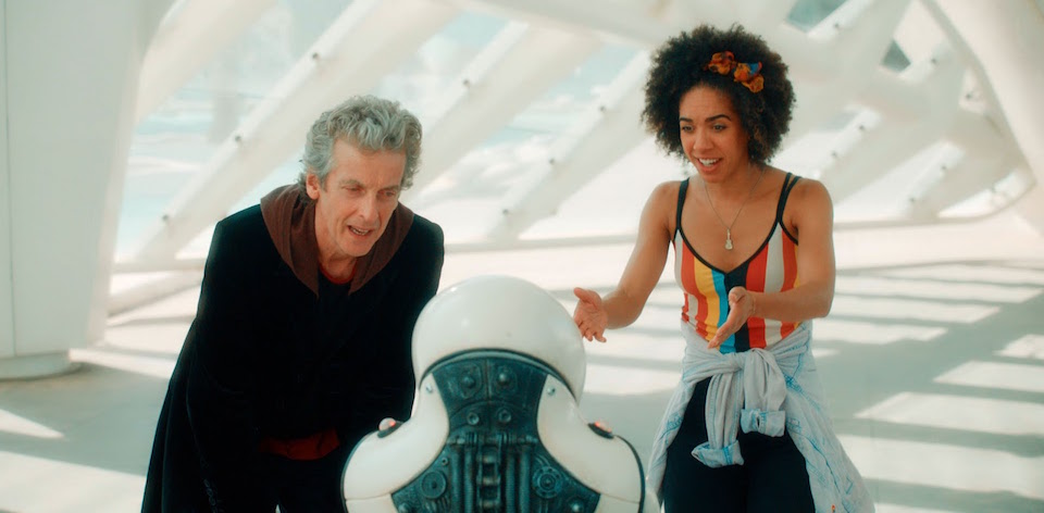 Programme Name: Doctor Who S10 - TX: 13/03/2017 - Episode: n/a (No. various episodes) - Picture Shows: Screen grab from episode two The Doctor (PETER CAPALDI), Emojibot, Bill (PEARL MACKIE) - (C) BBC - Photographer: screen grabs