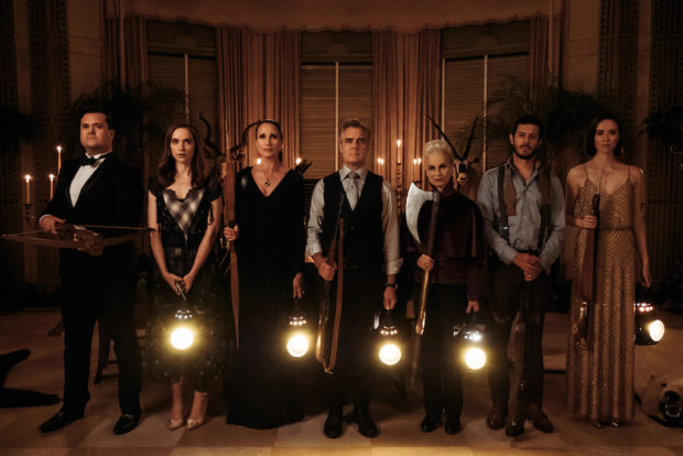 (L to R) Kristian Bruun, Melanie Scrofano, Andie MacDowell, Henry Czerny, Nicky Guadagni, Adam  Brody, and Elyse Levesque in the film READY OR NOT. Photo by Eric Zachanowich. © 2019 Twentieth Century Fox Film Corporation All Rights Reserved