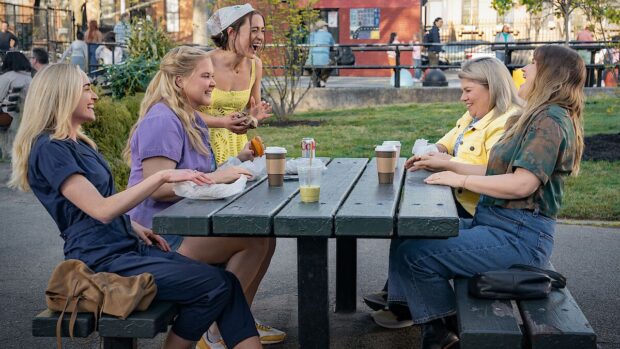 Kinda Pregnant (2025) - Brianne Howey, Amy Schumer, Lizze Broadway, Urzila Carlson and Jillian Bell sit around a picnic table laughing