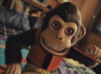 The drumming monkey from The Monkey (2025)