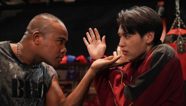 Putthipong Assaratanakul, aka Billkin about to get punched in The Red Envelope (2025)