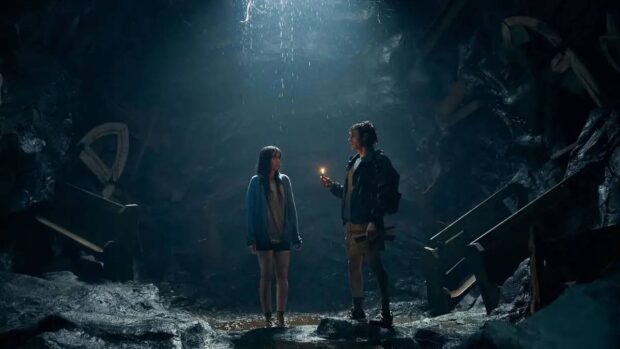Alison Brie and Dave Franco in a cave in Together (2025)