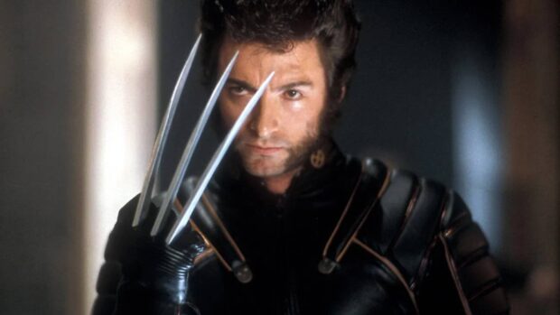 Wolverine in black leather suit with metal claws extended, ready for battle.